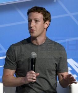 FILE - In this Feb. 24, 2014 file photo, Facebook CEO Mark Zuckerberg speaks during a conference at the Mobile World Congress in Barcelona, Spain. A Chinese government news portal on Monday, Dec. 8, 2014 released a photo of Zuckerberg with a copy of Chinese President Xi Jinping's book on governance at his desk while hosting a top Internet regulator from China, known for tight censorship. (AP Photo/Manu Fernandez, File)