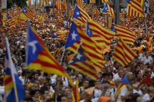 People wave pro-independence Catalan flags, known as the Estelada flag, during a rally calling for the independence of Catalonia, in Barcelona, Spain, Friday, Sept. 11, 2015. Advocates of independence for Spain's northeastern region of Catalonia on Friday launched their campaign to try to elect a majority of secessionists in regional parliamentary elections on Sept. 27. (AP Photo/Francisco Seco)