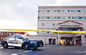 Wilfrid Laurier University's campus is in lockdown after security was tipped to a possible threat on Friday, Oct. 16, 2015 in Waterloo, Ont. THE CANADIAN PRESS/Hannah Yoon