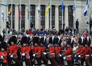 Spectators watch as the Governor General's Foot Guard marches as part of the Remembrance Day ceremony in Ottawa on Wednesday, Nov. 11, 2015. THE CANADIAN PRESS/Sean Kilpatrick