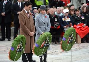 Prime Minister Justin Trudeau and his wife Sophie Gregoire-Trudeau look on after laying a wreath during the Remembrance Day ceremony in Ottawa on Wednesday, Nov. 11, 2015. THE CANADIAN PRESS/Sean Kilpatrick