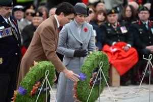 Prime Minister Justin Trudeau and his wife Sophie Gregoire-Trudeau place a wreath during the Remembrance Day ceremony in Ottawa on Wednesday, Nov. 11, 2015. THE CANADIAN PRESS/Sean Kilpatrick
