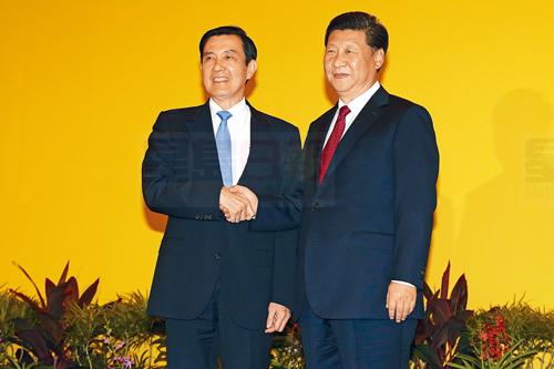 Chinese President Xi Jinping, right, and Taiwanese President Ma Ying-jeou, left, shake hands at the Shangri-la Hotel on Saturday, Nov. 7, 2015, in Singapore. The two leaders shook hands at the start of a historic meeting marking the first top level contact between the formerly bitter Cold War goes since they split amid civil war 66 years ago. (AP Photo/Wong Maye-E)