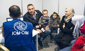 A family of Syrian refugees are interviewed by authorities in hope of being approved for passage to Canada at a refugee processing centre in Amman, Jordan November 29, 2015. REUTERS/Paul Chiasson/Pool