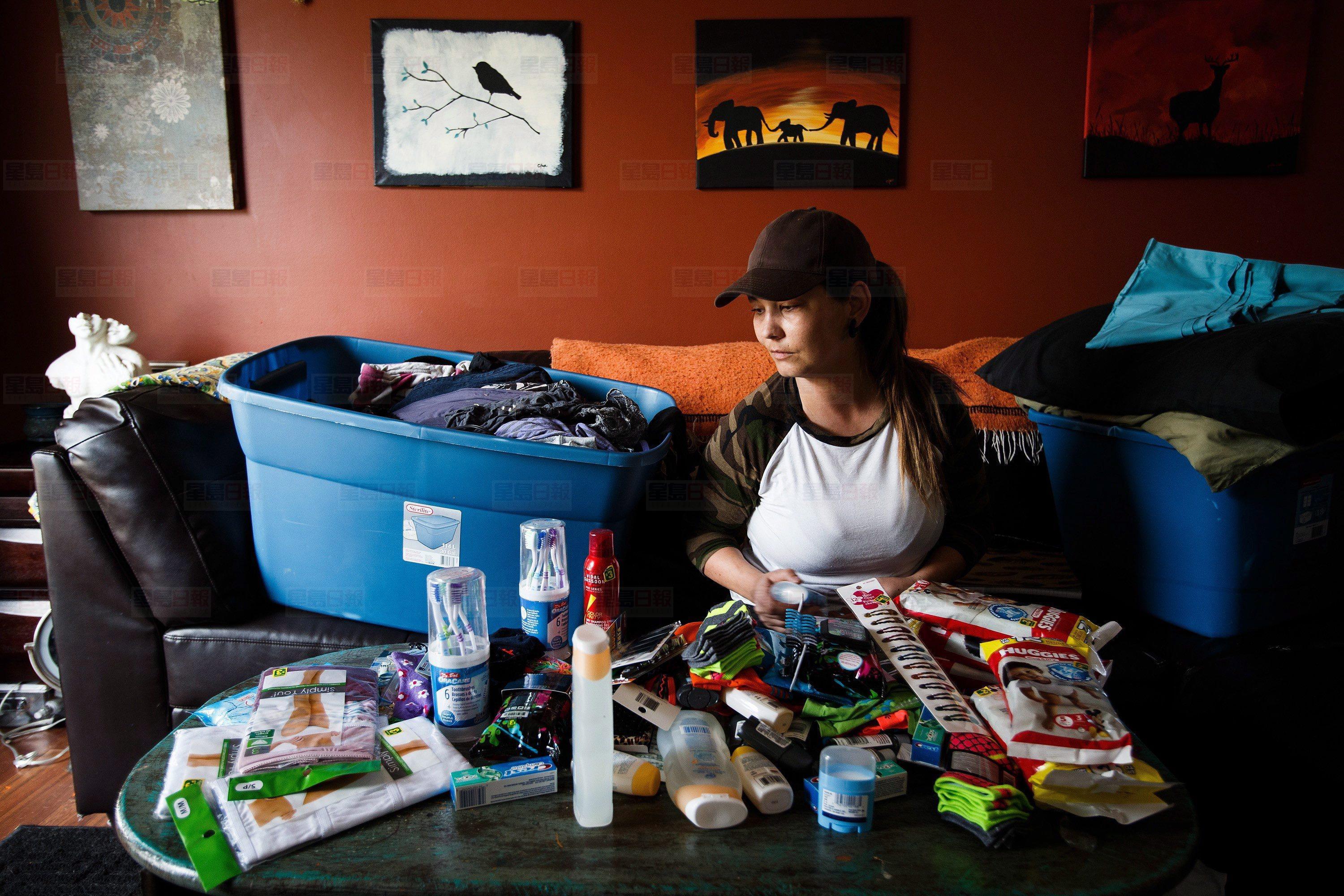 Char Kaye packs care packages for evacuees of the wildfires in and around Fort McMurray from her home in Spruce Grove Alta, on Wednesday, May 4, 2016. THE CANADIAN PRESS/Codie McLachlan