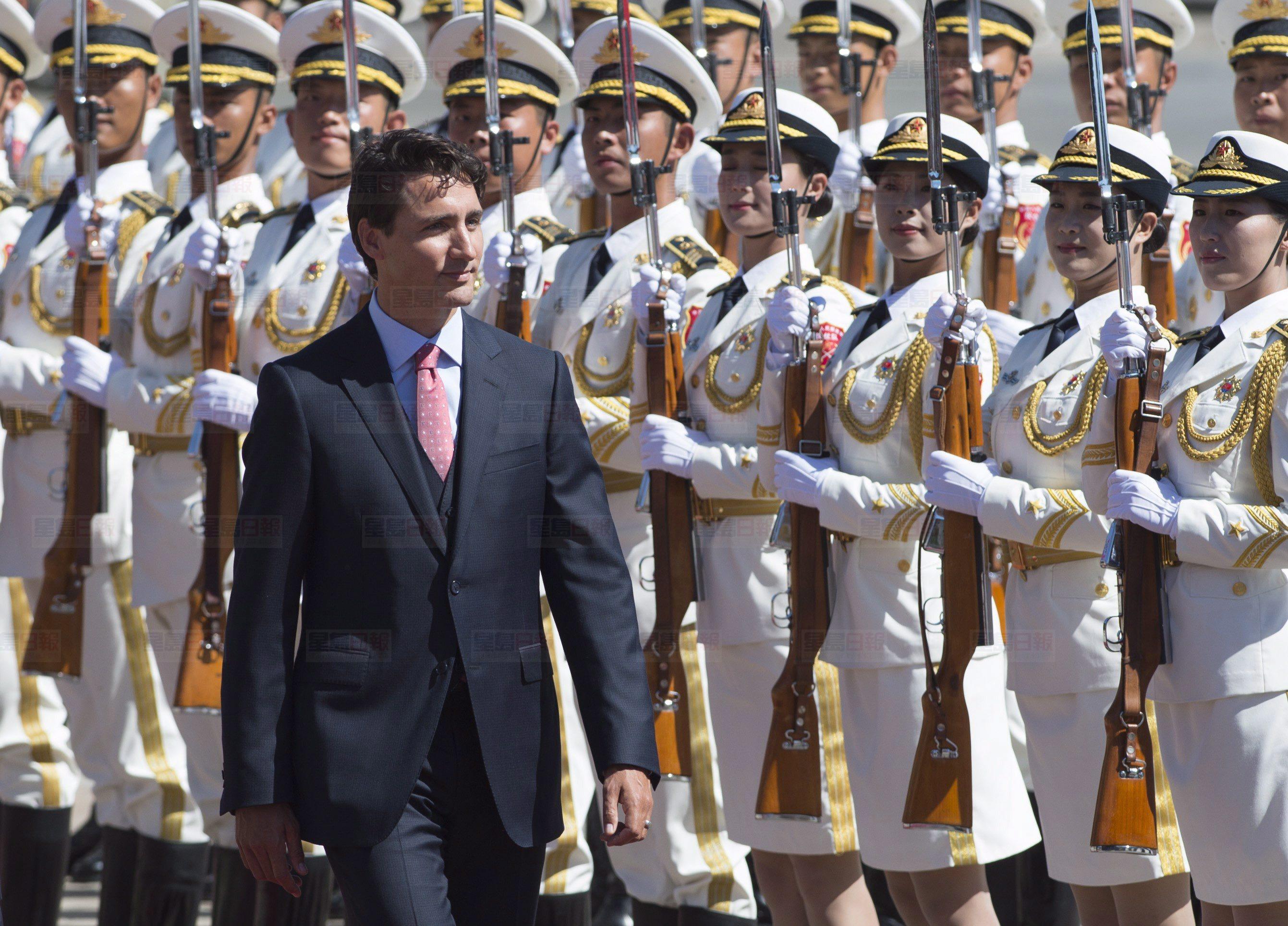 Canadian Prime Minister Justin Trudeau observes troops of the People's Liberation Army honour guard alongside the Premier of the People's Republic of China, Li Keqiang, left, in Beijing, China, on Wednesday, August 31, 2016. THE CANADIAN PRESS/Adrian Wyld