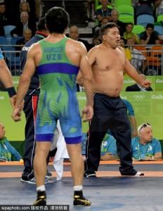Aug 21, 2016; Rio de Janeiro, Brazil; Coaches from Mongolia protest the match of  Ikhtiyor Navruzov (UZB) and Mandakhnaran Ganzorig (MGL) by taking off their clothes after the judges ruled in favor of Navruzov in a men's freestyle 65kg wrestling bronze medal match during the Rio 2016 Summer Olympic Games at Carioca Arena 2. Mandatory Credit: Michael Madrid-USA TODAY Sports  *** Please Use Credit from Credit Field ***