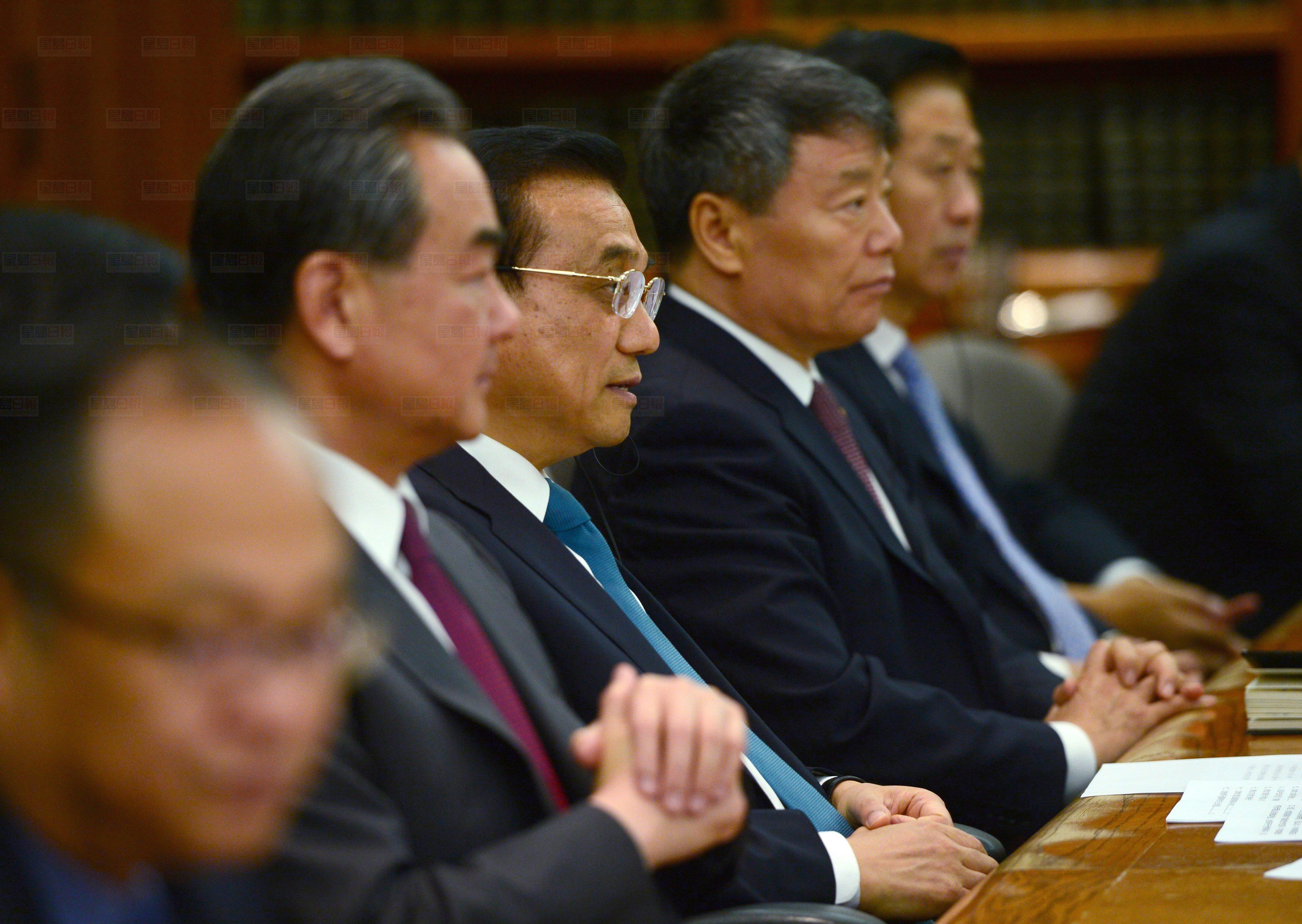Chinese Premier Li Keqiang, centre, takes part in a meeting with Canadian Prime Minister Justin Trudeau (not pictured) in the cabinet room on Parliament Hill in Ottawa on Thursday, Sept. 22, 2016. THE CANADIAN PRESS/Sean Kilpatrick