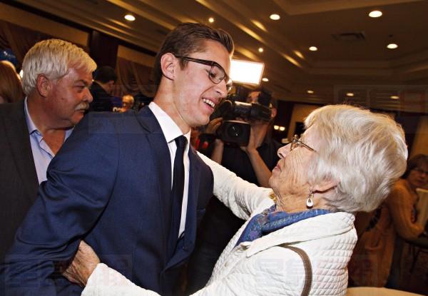 19-year-old Progressive Conservative candidate Sam Oosterhoff, left, is congratulated by his grandmother, Nell Oosterhoff after winning the byelection in Niagara-West Glanbrook, becoming Ontario's youngest-ever MPP, Thursday, November 17, 2016 in Grimsby. Oosterhoff will fill former PC leader Tim Hudak's seat. THE CANADIAN PRESS/Aaron Lynett