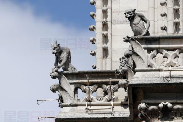 Preserved gargoyles of Notre Dame cathedral are pictured Wednesday, April 17, 2019 in Paris. Notre Dame Cathedral would have been completely burned to the ground in a "chain reaction collapse" had firefighters not moved rapidly in deploying their equipment to battle the blaze racing through the landmark monument, a Paris official said Wednesday. (AP Photo/Thibault Camus)