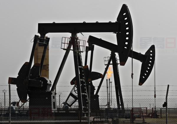 FILE - In this March 27, 2018 file photo, shows an oilfield controlled by a U.S-backed Kurdish group, in Rmeilan, Hassakeh province, Syria. Syrians living in government-controlled areas have survived eight years of war now face a new scourge in the form of widespread fuel shortages. (AP Photo/Hussein Malla, File)