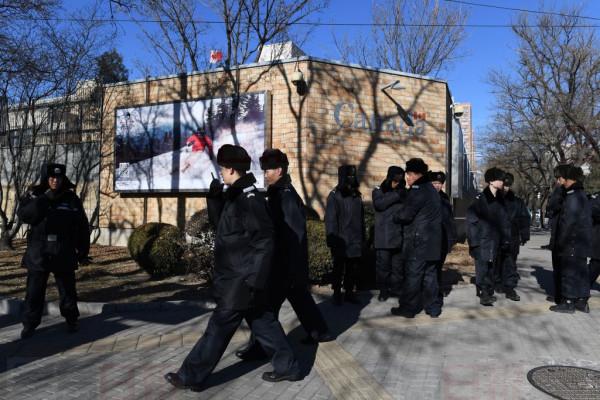 Chinese police patrol in front of the Canadian embassy in Beijing on December 13, 2018. - A second Canadian who had gone missing in China is under investigation on suspicion of "engaging in activities that harm China's national security", state media reported on December 13. Security has been stepped up outside the embassy since Meng Wanzhou, the chief financial officer of Chinese telecom giant Huawei, was arrested in Canada, at Washington's request. (Photo by GREG BAKER / AFP)        (Photo credit should read GREG BAKER/AFP/Getty Images)
