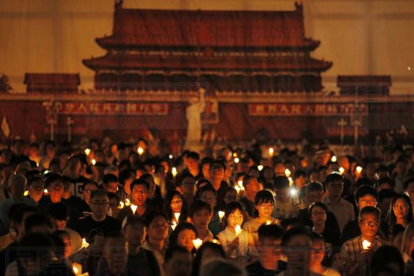 Thousands of people attend a candlelight vigil for victims of the Chinese government's brutal military crackdown three decades ago on protesters in Beijing's Tiananmen Square at Victoria Park in Hong Kong, Tuesday, June 4, 2019. Hong Kong is the only region under Beijing's jurisdiction that holds significant public commemorations of the 1989 crackdown and memorials for its victims. Hong Kong has a degree of freedom not seen on the mainland as a legacy of British rule that ended in 1997. (AP Photo/Kin Cheung)