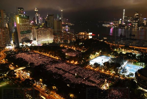 Thousands of people attend a candlelight vigil for victims of the Chinese government's brutal military crackdown three decades ago on protesters in Beijing's Tiananmen Square at Victoria Park in Hong Kong Tuesday, June 4, 2019. Hong Kong is the only region under Beijing's jurisdiction that holds significant public commemorations of the 1989 crackdown and memorials for its victims. Hong Kong has a degree of freedom not seen on the mainland as a legacy of British rule that ended in 1997. (AP Photo/Edwin Kwok)
