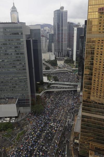Protesters gather outside the Legislative Council in Hong Kong, Wednesday, June 12, 2019. Thousands of protesters blocked entry to Hong Kong's government headquarters Wednesday, delaying a legislative session on a proposed extradition bill that has heightened fears over greater Chinese control and erosion of civil liberties in the semiautonomous territory. (AP Photo/Vincent Yu)