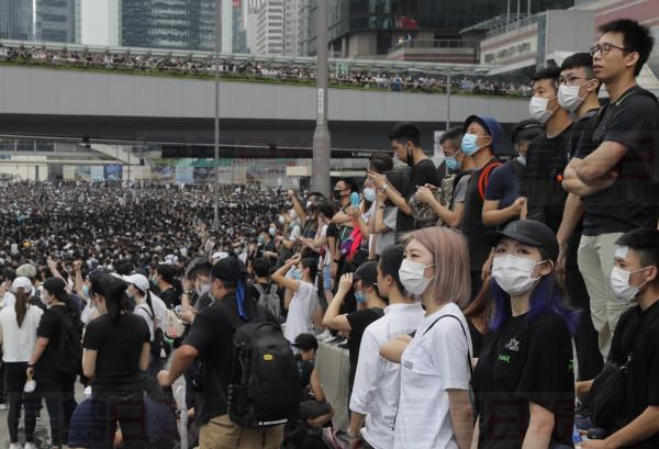 Protestors gather near the Legislative Council in Hong Kong, Wednesday, June 12, 2019. Thousands of protesters blocked entry to Hong Kong's government headquarters Wednesday, delaying a legislative session on a proposed extradition bill that has heightened fears over greater Chinese control and erosion of civil liberties in the semiautonomous territory. (AP Photo/Kin Cheung)