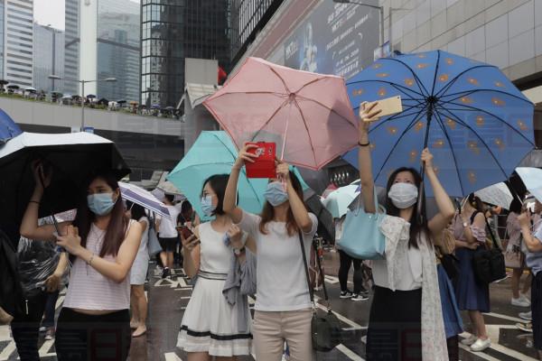Protestors gather near the Legislative Council in Hong Kong, Wednesday, June 12, 2019. Thousands of protesters blocked entry to Hong Kong's government headquarters Wednesday, delaying a legislative session on a proposed extradition bill that has heightened fears over greater Chinese control and erosion of civil liberties in the semiautonomous territory. (AP Photo/Kin Cheung)