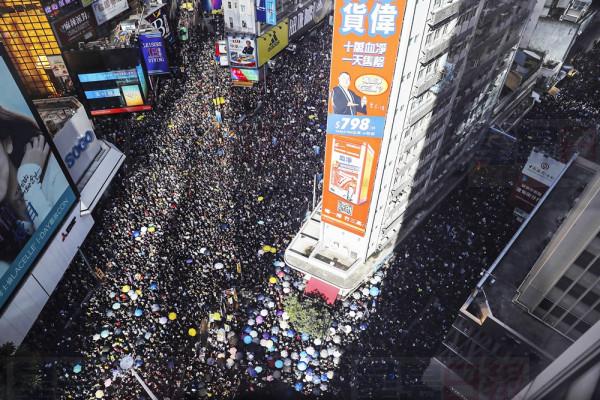 Ten of thousands of protesters flood the streets during a rally in Hong Kong, Monday, July 1, 2019. Combative protesters tried to break into the Hong Kong legislature Monday as a crowd of thousands prepared to start a march in that direction on the 22nd anniversary of the former British colony's return to China. (AP Photo/Kin Cheung)