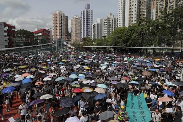 Protestors march to the Tuen Mun Park to protest against mainland Chinese singers causing nuisance to the local neighborhood, in Hong Kong, Saturday, July 6, 2019. The extradition protest sparked Hong Kong netizen to line more protest during the weekend, with focus on some local conflicts between mainland Chinese and Hong Kongers. (AP Photo/Kin Cheung)