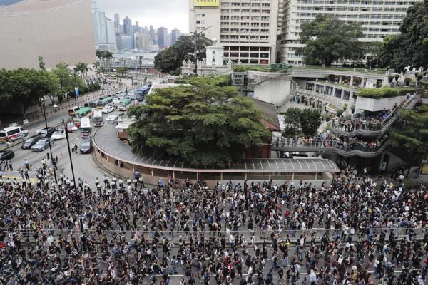 Protesters march in Hong Kong on Sunday, July 7, 2019. Thousands of people, many wearing black shirts and some carrying British flags, were marching in Hong Kong on Sunday, targeting a mainland Chinese audience as a month-old protest movement showed no signs of abating. (AP Photo/Kin Cheung)
