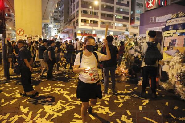 People pay their respects for protesters who were injured on Aug 31 outside Prince Edward station in Hong Kong on Friday, Sept. 6, 2019. The ratings agency Fitch on Friday cut Hong Kong's credit rating and warned that conflict with anti-government protesters was hurting the image of its business climate. (AP Photo/Kin Cheung)