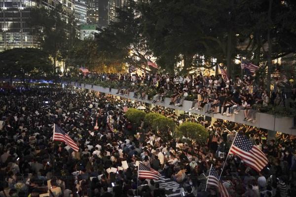 Protestors gather for a peaceful rally in central Hong Kong's business district, Monday, Oct. 14, 2019. The protests that started in June over a now-shelved extradition bill have since snowballed into an anti-China campaign amid anger over what many view as Beijing's interference in Hong Kong's autonomy that was granted when the former British colony returned to Chinese rule in 1997. (AP Photo/Felipe Dana)