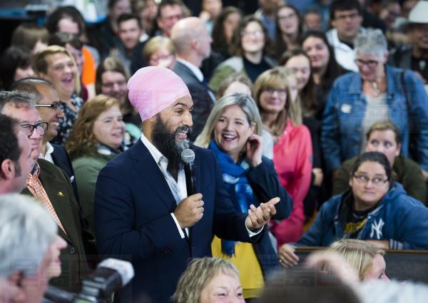 NDP leader Jagmeet Singh, left, and provincial NDP leader Andrea Horwath, right, speak to supporters at the Blue Star diner during a campaign stop in Welland Ont., on Thursday, October 17, 2019. THE CANADIAN PRESS/Nathan Denette