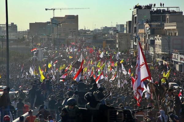 Mourners gather during a funeral procession for Abu Mahdi al-Muhandis, deputy commander of Iran-backed militias in Basra, Iraq, Tuesday, Jan. 7, 2020. Thousands of people gathered in Basra on Tuesday to bid farewell to Abu Mahdi al-Muhandis, a senior Iraqi militia commander who was killed in a US airstrike on Friday. (AP Photo)