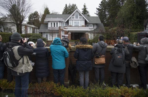 Media wait for Meng Wanzhou, chief financial officer of Huawei, to leave her home to attend a hearing in Vancouver, Monday, January, 20, 2020. THE CANADIAN PRESS/Jonathan Hayward