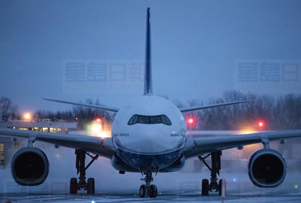A plane carrying 176 Canadian citizens from the centre of the global novel coronavirus outbreak in Wuhan, China, arrives at CFB Trenton, in Trenton, Ont., on Friday, Feb. 7, 2020. THE CANADIAN PRESS/Justin Tang