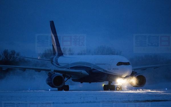 A plane carrying 176 Canadian citizens from the centre of the global novel coronavirus outbreak in Wuhan, China, arrives at CFB Trenton, in Trenton, Ont., on Friday, Feb. 7, 2020. THE CANADIAN PRESS/Justin Tang