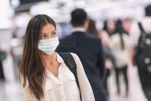 Virus mask Asian woman travel wearing face protection in prevention for coronavirus in China. Lady walking in public space bus station or airport.
