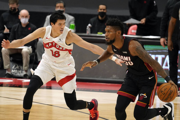 Toronto Raptors forward Yuta Watanabe, of Japan, (18) guards Miami Heat forward Chris Silva (30) during the second half of an NBA preseason basketball game Friday, Dec. 18, 2020, in Tampa, Fla. The Raptors are playing their home games in Tampa as a result of Canada's strict travel regulations stemming from the coronavirus pandemic. (AP Photo/Chris O'Meara)