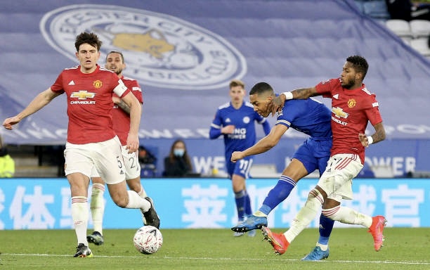 LEICESTER, ENGLAND - MARCH 21: Youri Tielemans of Leicester City scores their side's second goal whilst under pressure from Fred of Manchester United during the Emirates FA Cup Quarter Final  match between Leicester City and Manchester United at The King Power Stadium on March 21, 2021 in Leicester, England. Sporting stadiums around the UK remain under strict restrictions due to the Coronavirus Pandemic as Government social distancing laws prohibit fans inside venues resulting in games being played behind closed doors.  (Photo by Alex Pantling/Getty Images)