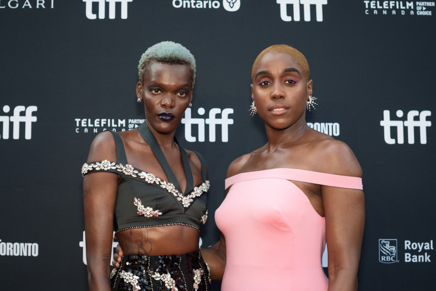 (L-R) Actors Sheila Atim and Lashana Lynch pose for a photograph on the red carpet for the film, The Woman King, at Roy Thomson Hall during night two of the Toronto International Film Festival on, Friday, September 9, 2022. THE CANADIAN PRESS/ Tijana Martin
