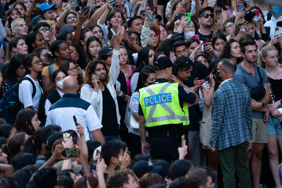 Fans of Taylor Swift wait outside of the TIFF Bell Lightbox in hopes of catching a glimpse of the musician during the Toronto International Film Festival in Toronto on Friday, September 9, 2022. THE CANADIAN PRESS/Alex Lupul