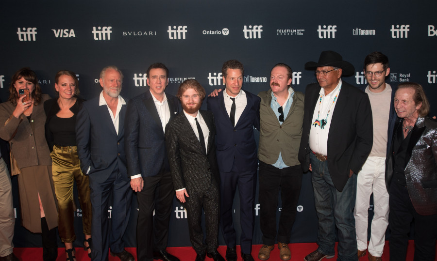 The red carpet attendees pose for a photograph prior to the premier of the film Butcher's Crossing, at Roy Thomson Hall during night two of the Toronto International Film Festival on, Friday, September 9, 2022. THE CANADIAN PRESS/ Tijana Martin