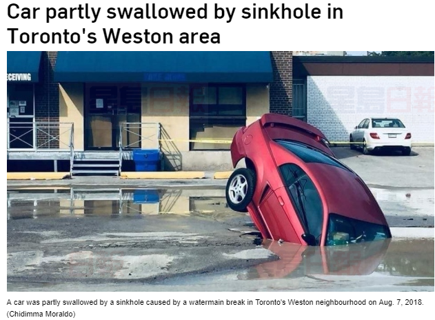 多倫多主水管爆破，圖中司機被困污水坑